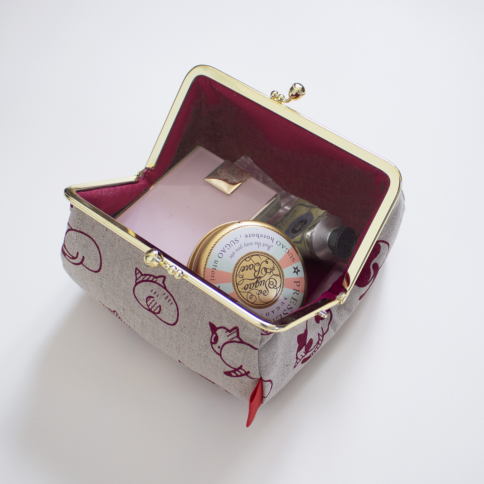 ねこのおしりのがま口ポーチ（れんが色)の画像