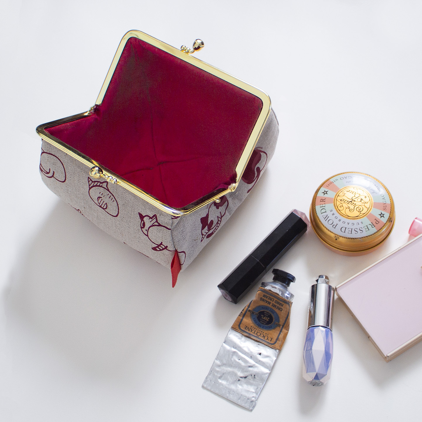 ねこのおしりのがま口ポーチ（れんが色)の画像