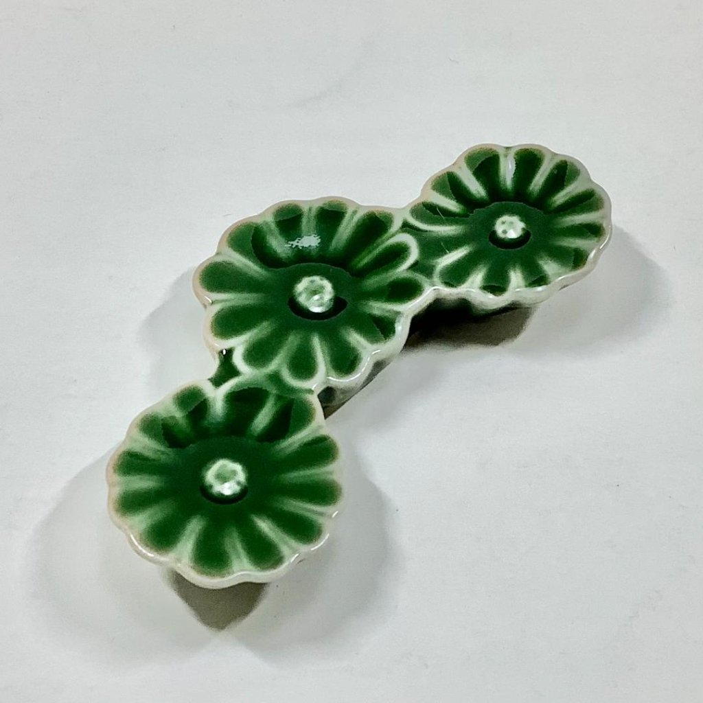 茶緑釉菊形箸置の画像