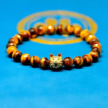 10ｍｍの猫顔(18金）と８mm多面カットタイガーアイのブレスレットの画像