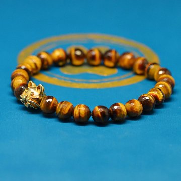 10ｍｍの猫顔(18金）と８mm多面カットタイガーアイのブレスレットの画像